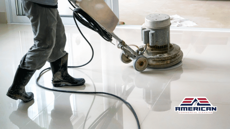 A cleaner using a heavy-duty floor polisher to restore the shine and cleanliness of tiled flooring in a commercial space.